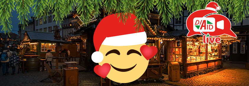 Ein glückliches Emoticon for einem Weihnachtsmarkt